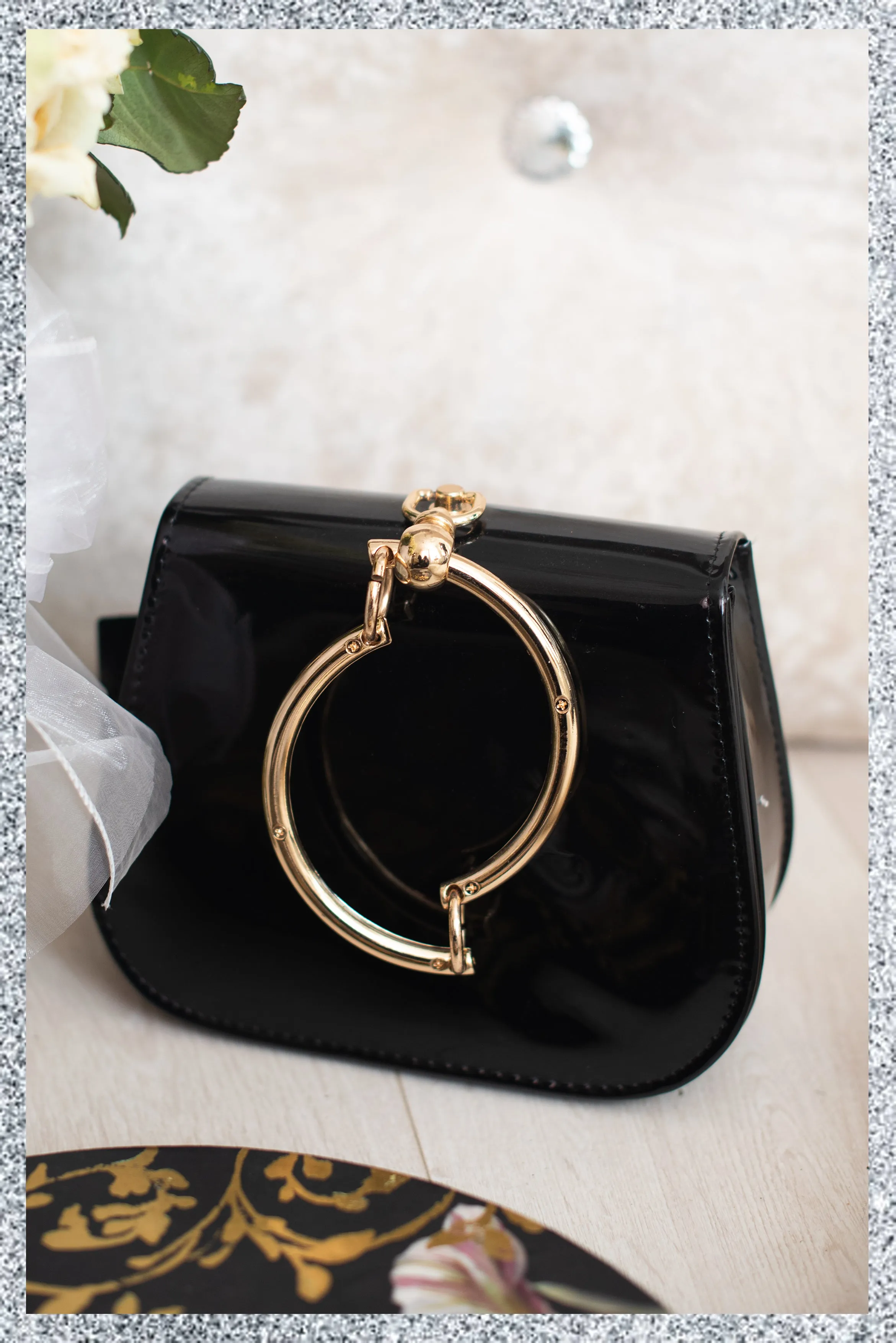 Gold Circle Handle Patent Handbag