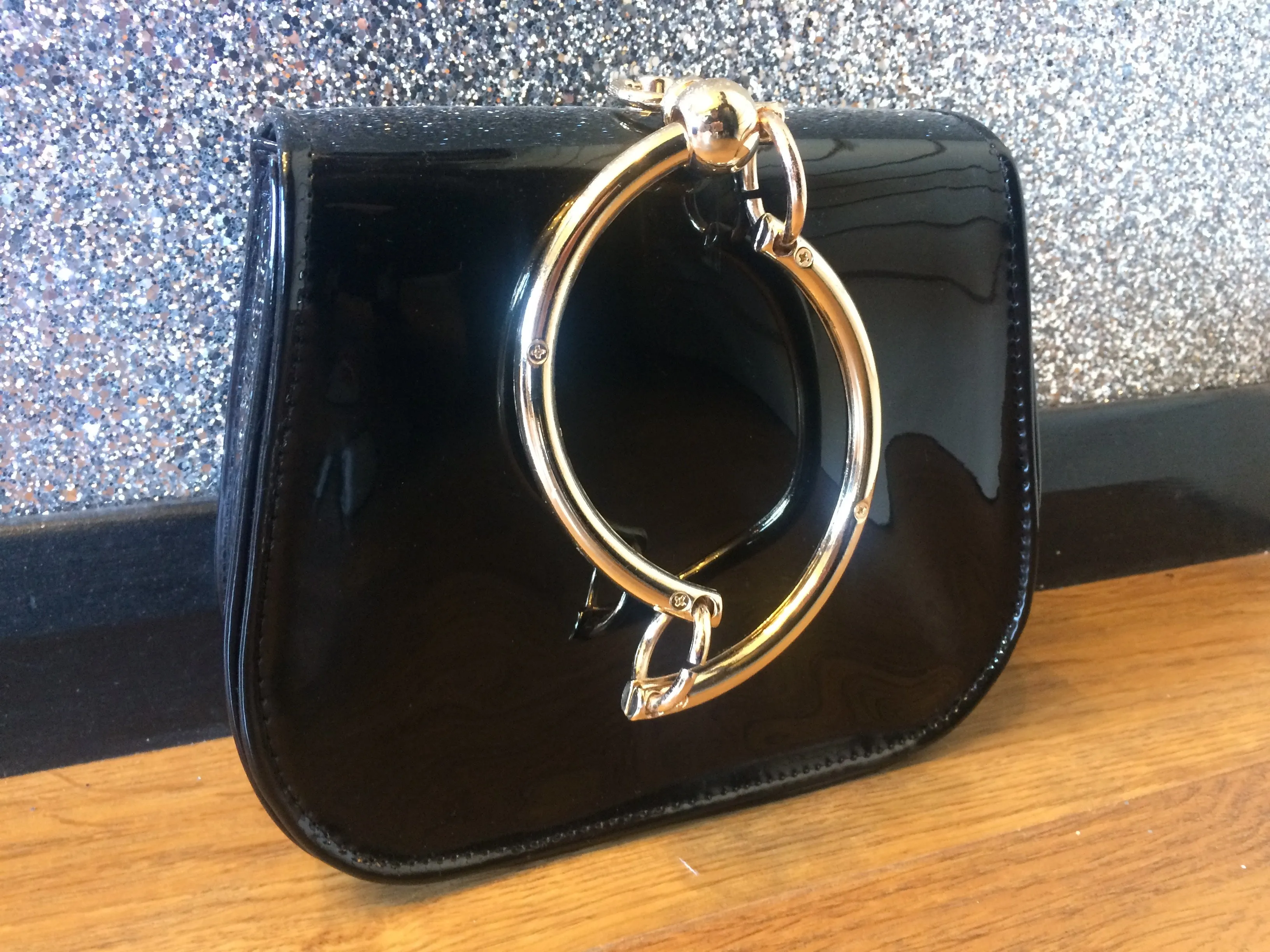 Gold Circle Handle Patent Handbag