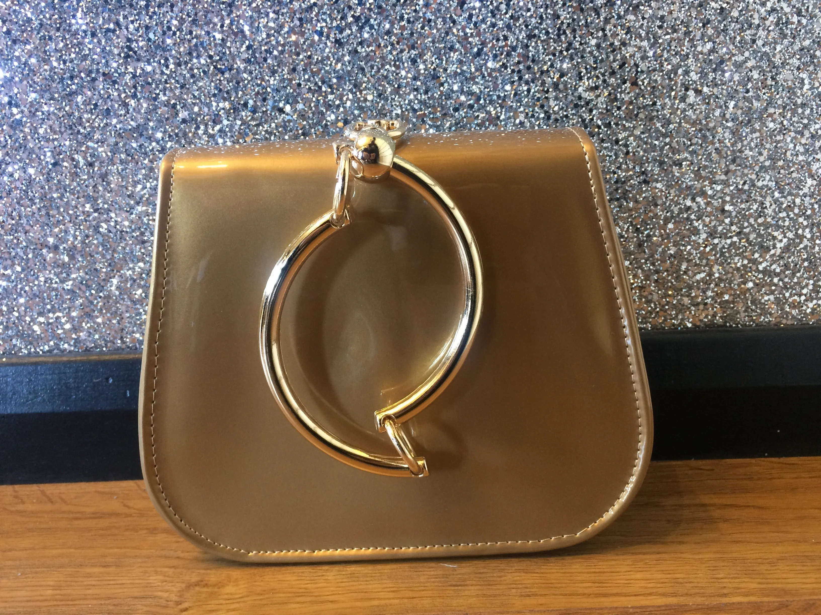 Gold Circle Handle Patent Handbag