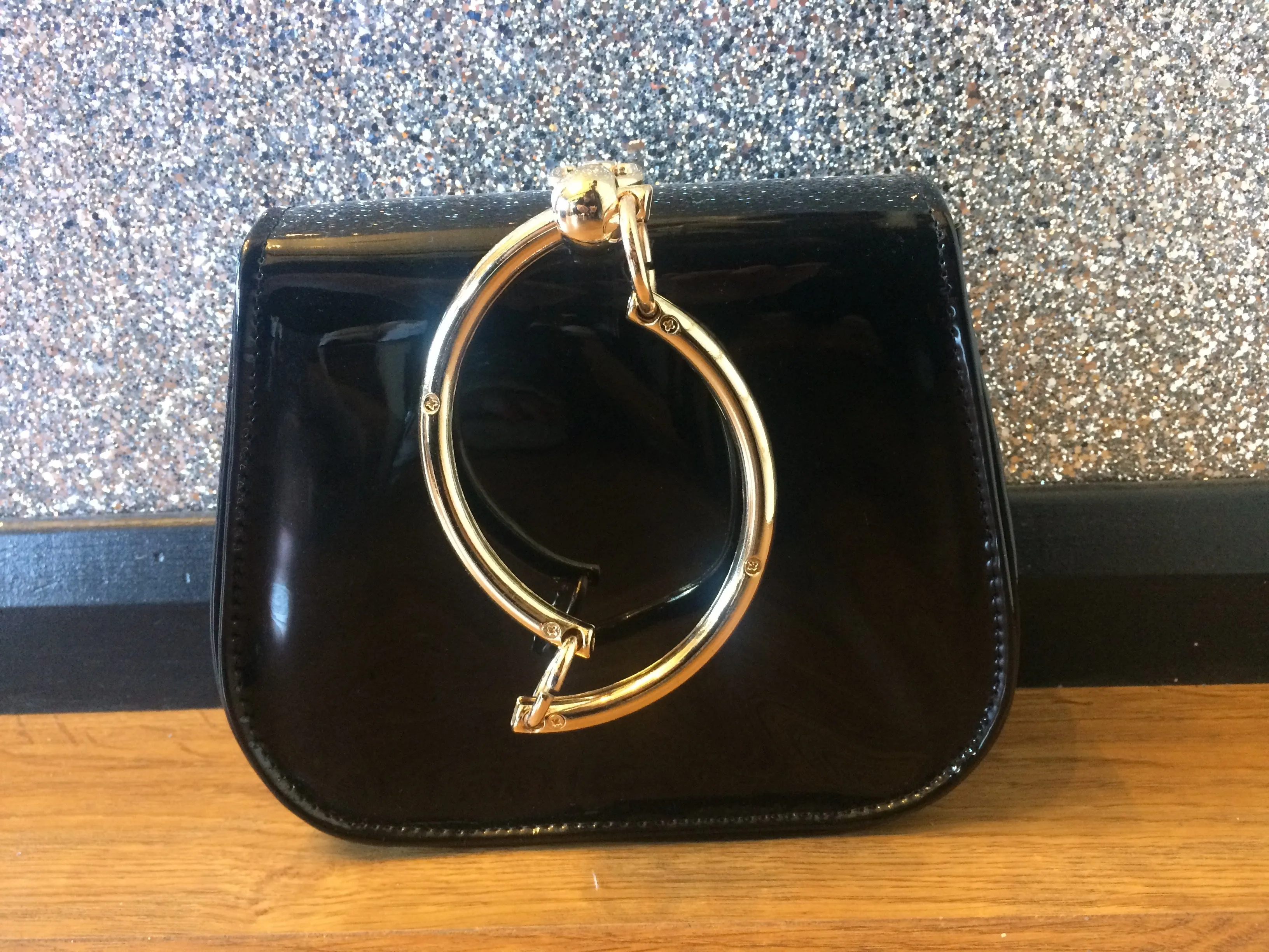 Gold Circle Handle Patent Handbag